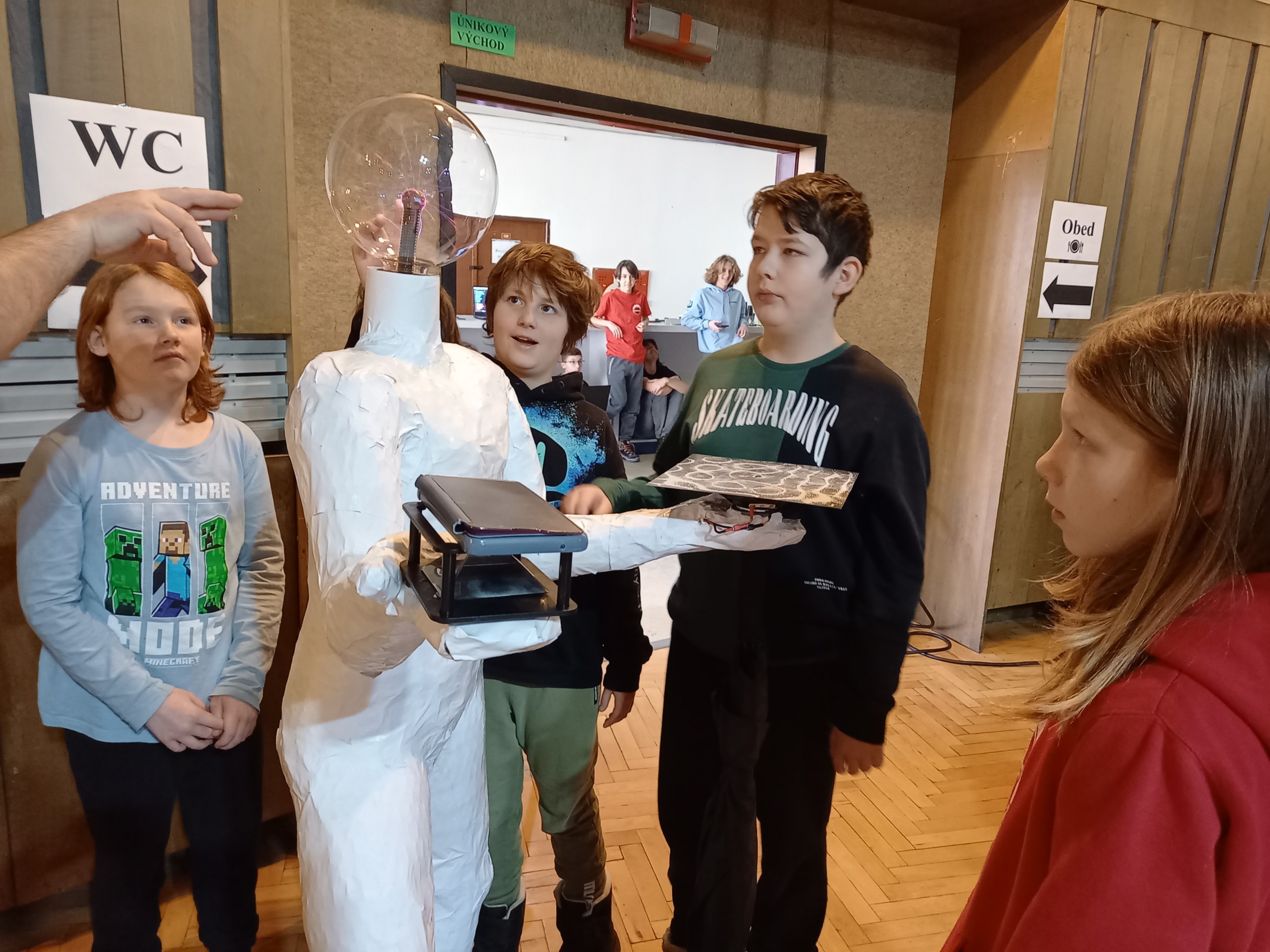 Us presenting the statue to others at a competition